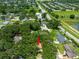 An aerial shot highlighting the property's location amongst lush trees in a residential neighborhood at 616 Pawn Way, Seffner, FL 33584