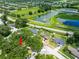 Aerial view of the property highlighting its location near lakes and green spaces in a residential area at 616 Pawn Way, Seffner, FL 33584