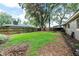 Spacious fenced backyard with lush lawn offering plenty of room for recreation and outdoor activities at 616 Pawn Way, Seffner, FL 33584