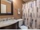 Bathroom featuring tile floors, vanity, mirror, and a shower with a patterned curtain at 616 Pawn Way, Seffner, FL 33584