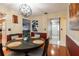 Comfortable dining room with wood floors, ample seating, and a warm atmosphere at 616 Pawn Way, Seffner, FL 33584