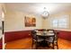 Cozy dining room featuring a round table, decorative lighting, and a serene ambiance at 616 Pawn Way, Seffner, FL 33584