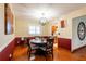 Inviting dining area with a round table, wood floors, and stylish decor at 616 Pawn Way, Seffner, FL 33584