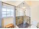 Bathroom showcasing glass enclosed shower with decorative tile surround at 6250 Fairskies Dr, New Port Richey, FL 34655