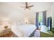 Bedroom with neutral walls, ceiling fan, and view of pool at 6250 Fairskies Dr, New Port Richey, FL 34655