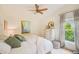 Bright bedroom with ceiling fan and plenty of natural light at 6250 Fairskies Dr, New Port Richey, FL 34655