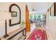 View of entryway showing hall table, mirror, and decorative accents at 6250 Fairskies Dr, New Port Richey, FL 34655