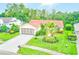 Charming single-story home with a well-manicured lawn, landscaped garden, and a two-car garage at 6250 Fairskies Dr, New Port Richey, FL 34655