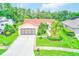 Well-maintained single Gathering home with a two car garage and mature landscaping at 6250 Fairskies Dr, New Port Richey, FL 34655
