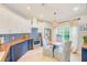 A charming kitchen displays two-tone cabinets, wood countertops, stainless steel appliances, and a breakfast nook at 6250 Fairskies Dr, New Port Richey, FL 34655