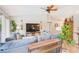 Open concept living room with comfortable sectional and accent furnishings at 6250 Fairskies Dr, New Port Richey, FL 34655