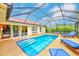 Relax in the screened pool area with easy access to the home at 6250 Fairskies Dr, New Port Richey, FL 34655