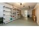 Spacious garage featuring durable flooring and shelving units for optimal storage organization at 6263 93Rd N Ter # 4202, Pinellas Park, FL 33782