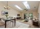 Bright and airy living room with skylights, ceiling fan, modern furniture, and glass sliding doors to patio at 6263 93Rd N Ter # 4202, Pinellas Park, FL 33782