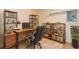 This home office features a wood desk, leather chair, and shelving for a functional and stylish workspace at 6263 93Rd N Ter # 4202, Pinellas Park, FL 33782