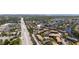 Expansive aerial view showcasing waterfront community, lush landscaping, nearby shopping, and Intracoastal Waterway access at 6338 Newtown Cir # 38A6, Tampa, FL 33615
