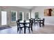 Bright dining area with large windows, offering a welcoming space for Gathering meals and gatherings at 6338 Newtown Cir # 38A6, Tampa, FL 33615