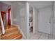 Entryway features wood stairs, a tile floor, and a partial view of a toilet at 6338 Newtown Cir # 38A6, Tampa, FL 33615