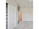 A bright bedroom features a closet and a neutral color scheme at 6447 Bradford Woods Dr, Zephyrhills, FL 33542