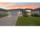 Charming single-story home featuring a well-maintained lawn and inviting front entrance at 6447 Bradford Woods Dr, Zephyrhills, FL 33542
