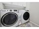 Convenient laundry room with modern appliances and built in cabinets at 6447 Bradford Woods Dr, Zephyrhills, FL 33542