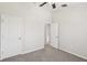 Neutrally painted bedroom features carpeted floor and large doorways at 7001 Interbay Blvd # 203, Tampa, FL 33616