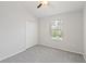 Neutral bedroom with a double closet and a large window offering natural light at 7001 Interbay Blvd # 203, Tampa, FL 33616