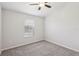 Bedroom featuring a ceiling fan and a window offering natural light at 7001 Interbay Blvd # 203, Tampa, FL 33616