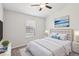 Bedroom featuring stylish décor, a double closet, and a large window for natural light at 7001 Interbay Blvd # 203, Tampa, FL 33616