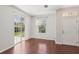 Bright dining area featuring hardwood floors and sliding glass doors to the outside at 7001 Interbay Blvd # 203, Tampa, FL 33616