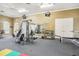 A community gym with weight machines, TVs, free weights, and ample workout space for residents to enjoy at 7001 Interbay Blvd # 203, Tampa, FL 33616