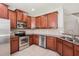 Well-equipped kitchen featuring stainless steel appliances, granite countertops, and wood cabinetry at 7001 Interbay Blvd # 203, Tampa, FL 33616