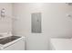 Functional laundry area equipped with a washing machine, dryer, and storage shelves for convenience at 7001 Interbay Blvd # 203, Tampa, FL 33616