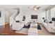 Bright living room with stylish white furniture, hardwood floors, and a ceiling fan at 7001 Interbay Blvd # 203, Tampa, FL 33616