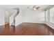 Bright living room featuring hardwood floors, staircase, and natural light at 7001 Interbay Blvd # 203, Tampa, FL 33616