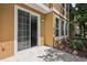 Spacious patio with sliding glass doors leading into the home's interior and a large bank of windows to the right at 7001 Interbay Blvd # 203, Tampa, FL 33616