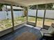 Relaxing screened patio features tile floors and backyard at 7301 Mitchell Ranch Rd, New Port Richey, FL 34655