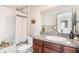 Well-lit bathroom with granite countertop, shower, and modern fixtures at 7405 French Marigold Ave, Tampa, FL 33619