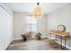 Bright bedroom with wood floors, rattan furniture, and natural light at 7405 French Marigold Ave, Tampa, FL 33619