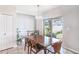 Bright dining room featuring a wooden table, chandelier lighting, and sliding glass doors to the backyard at 7405 French Marigold Ave, Tampa, FL 33619
