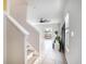 Bright entryway with tile floors, staircase, large windows and view into the adjacent living spaces at 7405 French Marigold Ave, Tampa, FL 33619