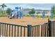Community playground with slides, swings, and climbing structures for to enjoy at 7405 French Marigold Ave, Tampa, FL 33619