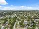 An aerial perspective highlighting the lush tree canopy and diverse residential layout of a suburban neighborhood at 8897 54Th N St, Pinellas Park, FL 33782