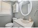 Neutral bathroom with white vanity, modern faucet, and ample lighting at 8897 54Th N St, Pinellas Park, FL 33782