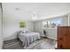 Serene bedroom with neutral colors, wood-look floors, and ample natural light at 8897 54Th N St, Pinellas Park, FL 33782
