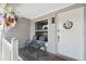 Cozy front porch with seating, decorative accents, and a welcoming entrance at 8897 54Th N St, Pinellas Park, FL 33782