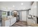 Bright kitchen features stainless steel appliances, granite countertops, and white cabinetry at 8897 54Th N St, Pinellas Park, FL 33782
