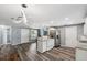 Open concept kitchen features modern lighting, stainless appliances, and neutral paint at 8897 54Th N St, Pinellas Park, FL 33782