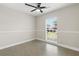 Well lit bedroom has ceramic floors and a bright window providing pleasant natural light at 9105 Camino Villa Blvd, Tampa, FL 33635