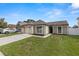 Lovely single-story home featuring an attached garage and a well-maintained front lawn with a charming curb appeal at 9105 Camino Villa Blvd, Tampa, FL 33635